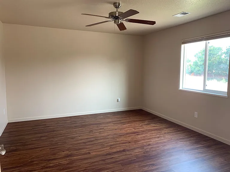 Master bedroom with view to back yard