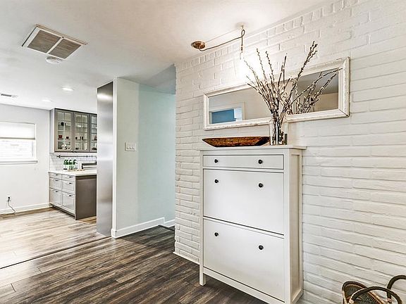 Come on in...to this charming warm entrance from the front door