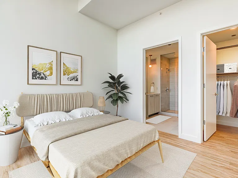 Wake up to calm_this bedroom blends comfort, style, and convenience.