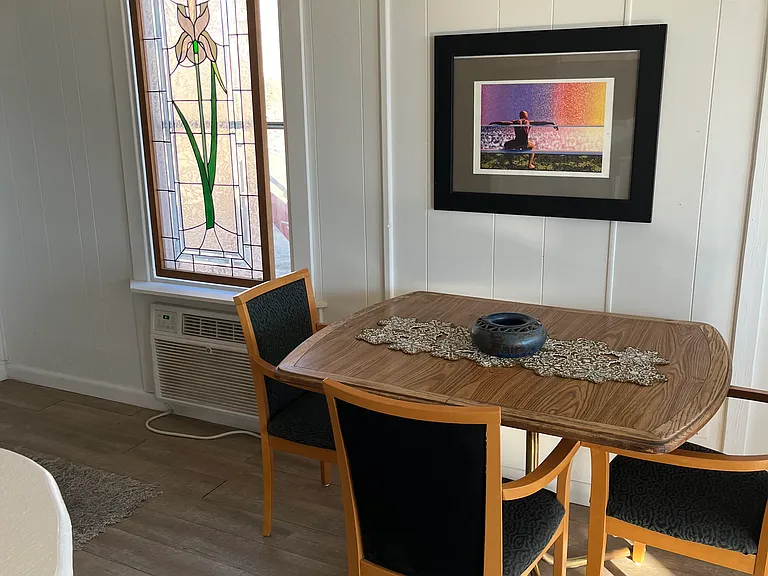 Dining area with stained glass and Air conditioner