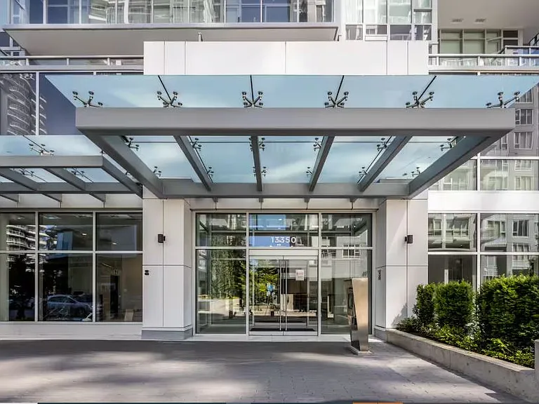 This is the entrance to the condominium, featuring a modern and secure lobby.