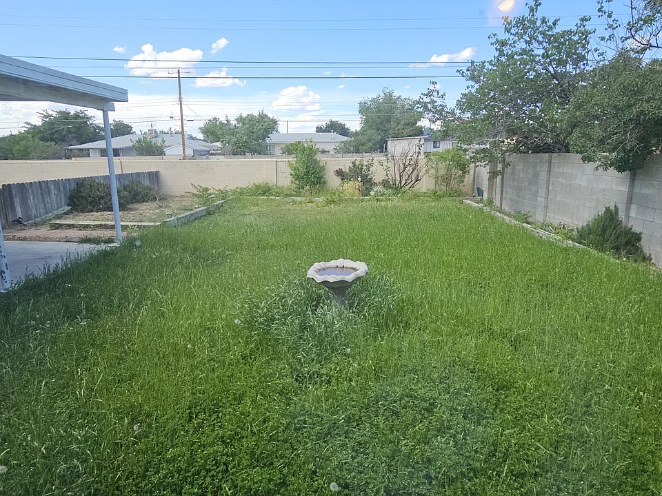Big back porch and back yard in summer that backs up to an arroyo so no near neighbors on the back side