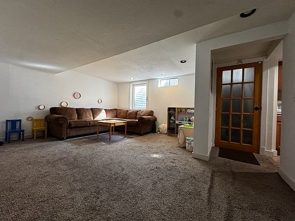 spacious living area, couch can stay if desired