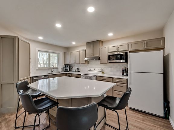 Kitchen with huge island. Refrigerator included!