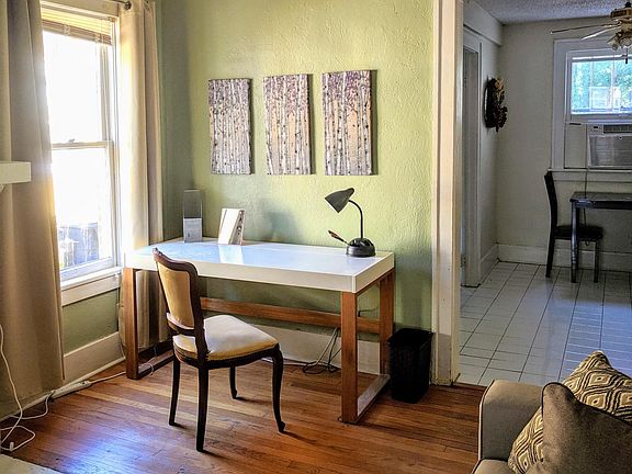 White top desk/table is included.