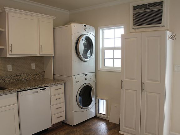 Stack washer/ gas dryer, pantry, a/c and ceiling fan.
