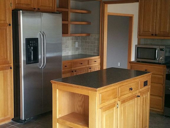 Kitchen with Stainless Steel Refridgerator, Dishwasher, and