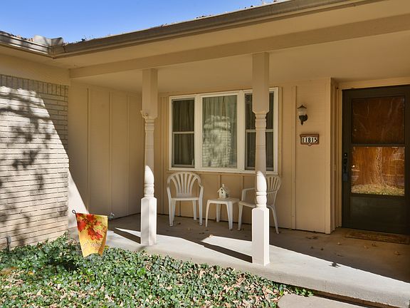 The covered front porch provides a great space to greet your guests.