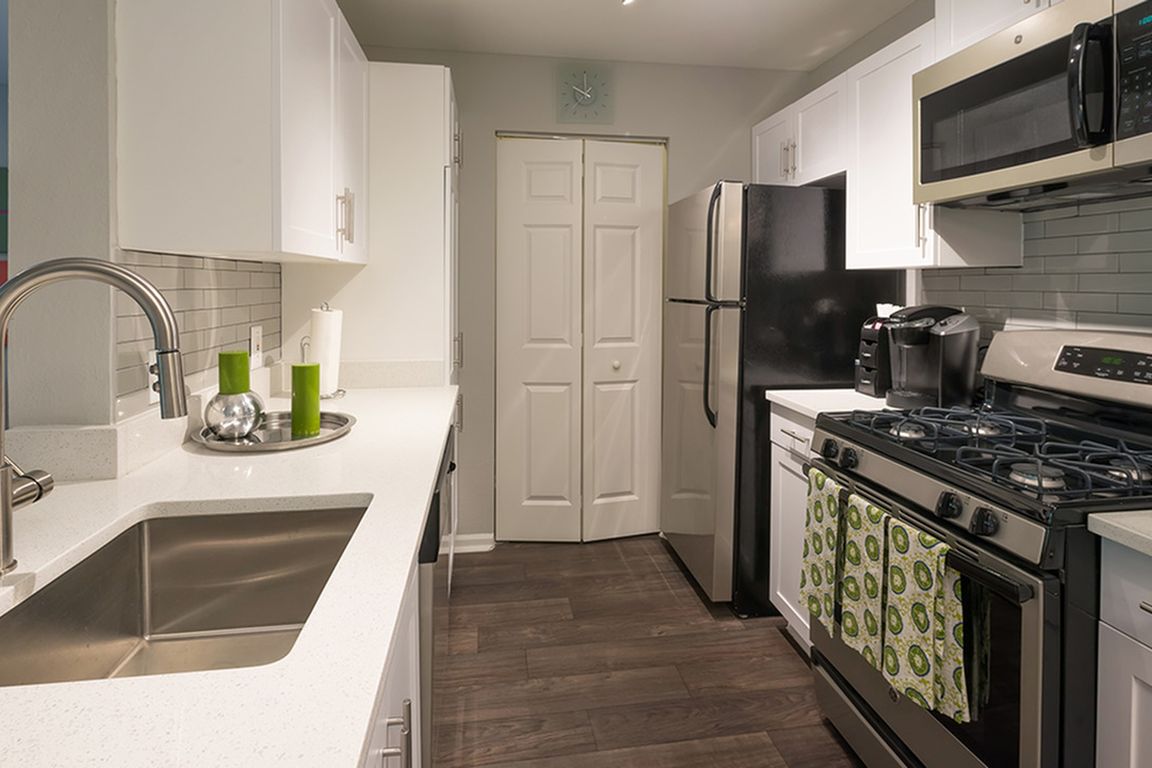 Redesigned kitchens with granite counters, stainless steel appliances and subway tile