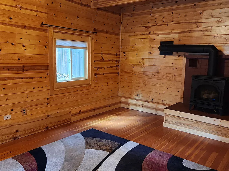 The Living Room has an open beam ceiling and many other unique features.