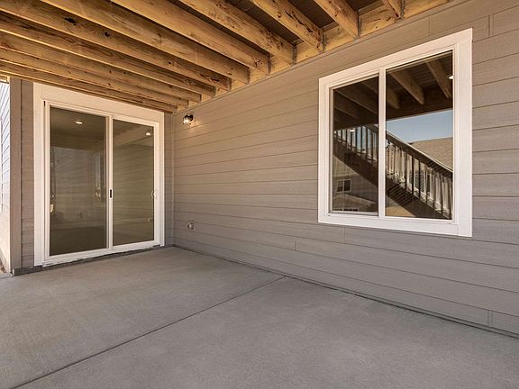 Rear exterior door to walkout basement under covered patio