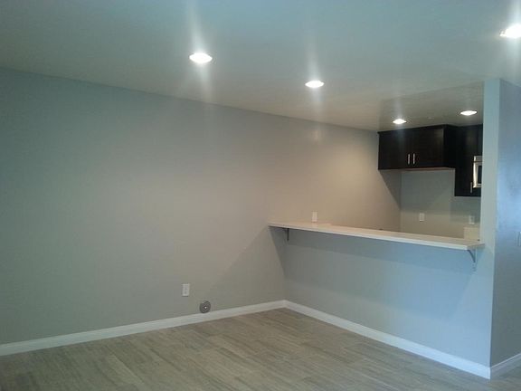 LIVING ROOM FACES KITCHEN