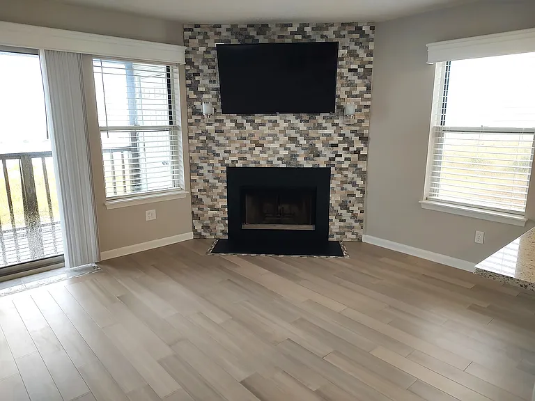 Living Rm with Custom Travertine Ledger Tile with Wood Burning Fireplace & Custom 2 1/2" Blinds