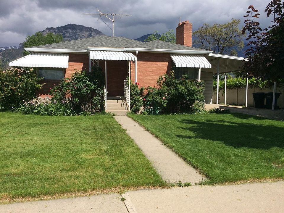Lawn and flowers in front yard. Fenced back yard.