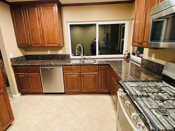 Updated kitchen with stainless steel appliances.
