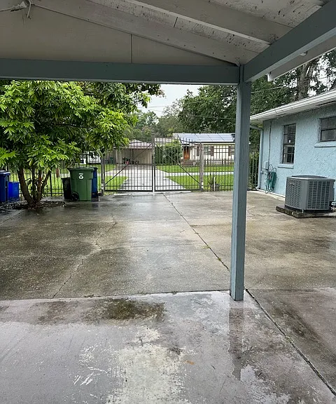 fenced in yard and car port