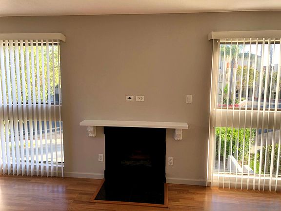 Living Room with fire place, hardwood floor every where