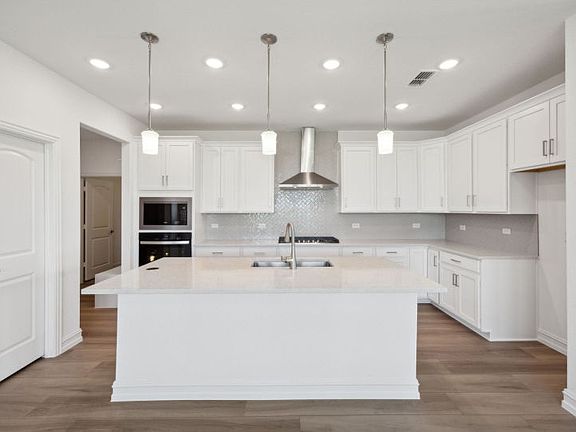 Airy kitchen with ample cabinet space real home pictured