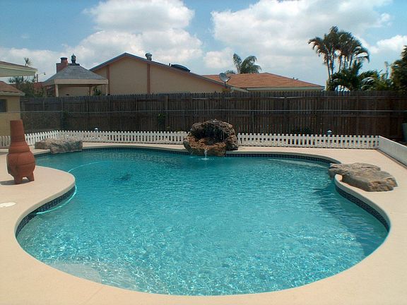 Swimming Pool With Rock Waterfall & Diamond Brite Finishing