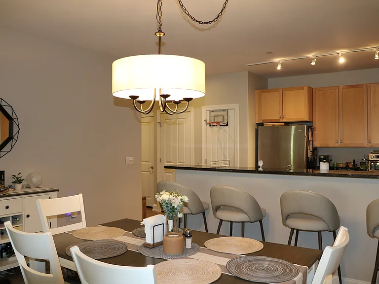 Elegant dining area with a gorgeous chandelier and room to gather
