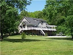 Home features a wrap-around deck & screened porch!