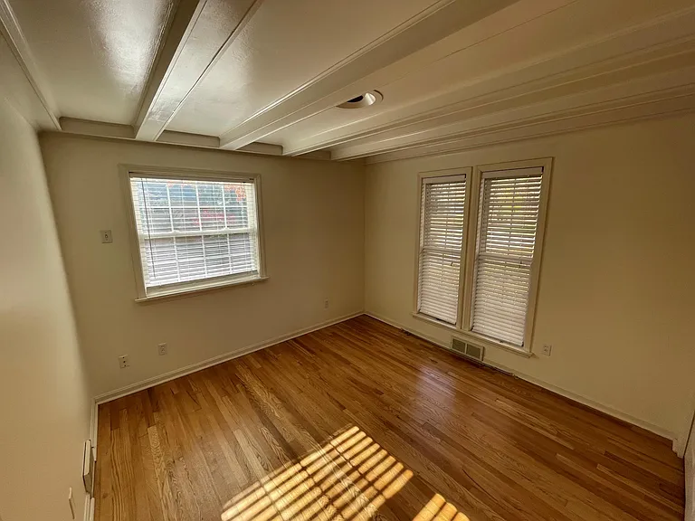 BR 2: Large windows, closet, beamed ceiling, hardwood floors