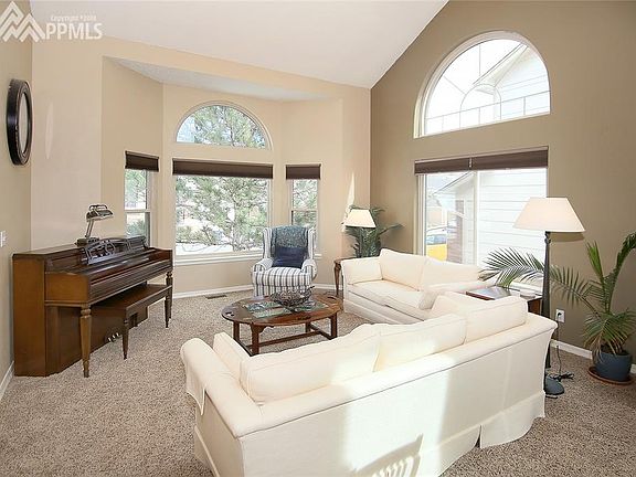 Gorgeous formal living room with huge windows
