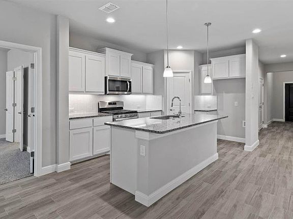 Kitchen - All Home and community information, including pricing, included features, terms, availability and amenities, are subject to change at any time without notice or obligation. All Drawings, pictures, photographs, video, square footages, floor plans, elevations, features, colors and sizes are approximate for illustration purposes only and will vary from the homes as built.