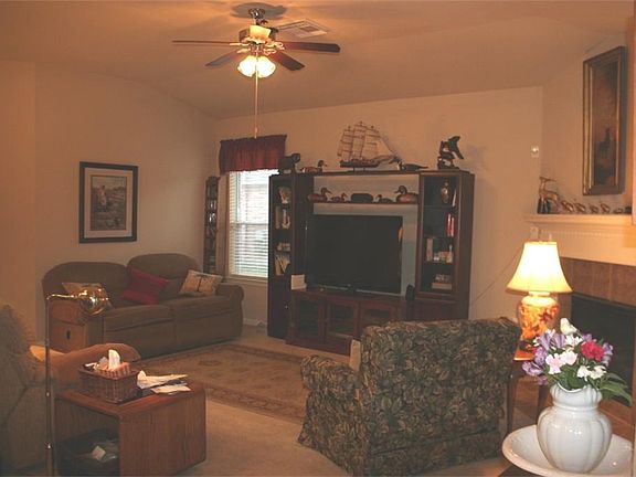 Another view of the Living Room . Features Tall Ceilings