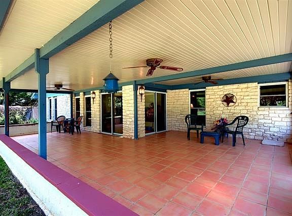 And now.. the oversized covered patio.  Ceiling fans. Tiled flooring. Vinyl for maintenance free care. It just says "party time"