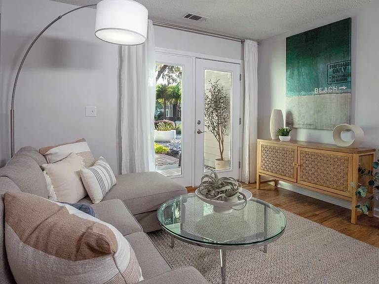 Embrace upscale living in our bright, spacious living rooms with French doors, inviting you to extend your living space to a private screened-in patio or balcony.
