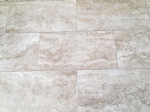 Ceramic Tile Throughout.