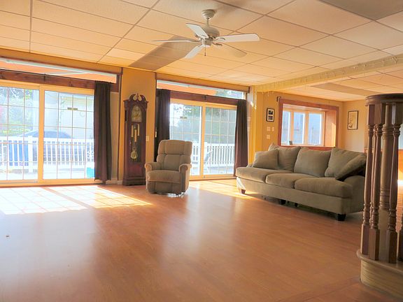 2 sets of sliders open to stone patio.