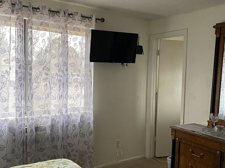 Queen upstairs room with TV, Great Views, private bathroom, big closets, and great double dresser with hidden, private drawers.
