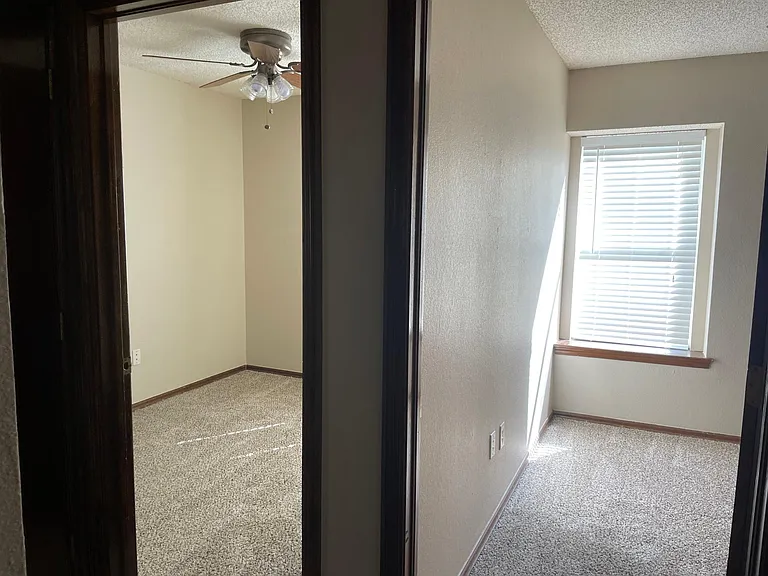 Hallway showing two bedrooms