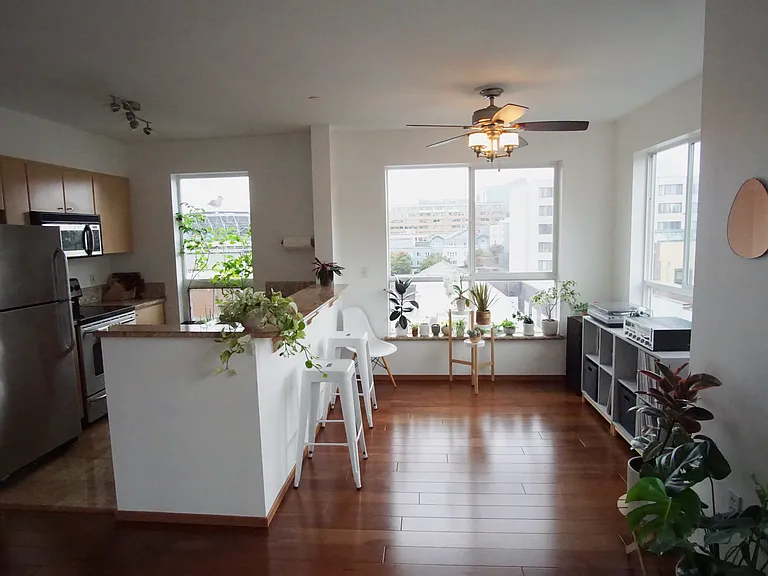 view of kitchen and dining area with large windows
