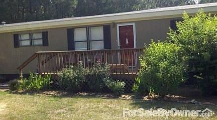 Above ground pool in fenced in back yard