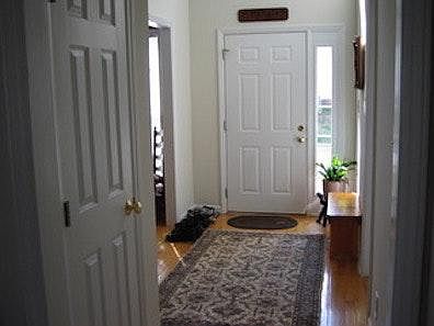 Hardwood Foyer --with tons of light from arch window over front door.
