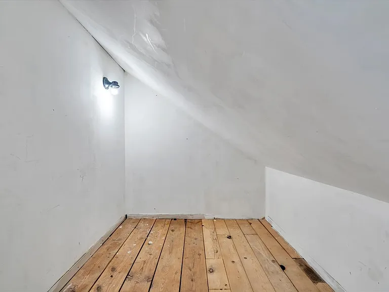 One of Three Closets in Finished Attic. The Two Other Closets have Rods.