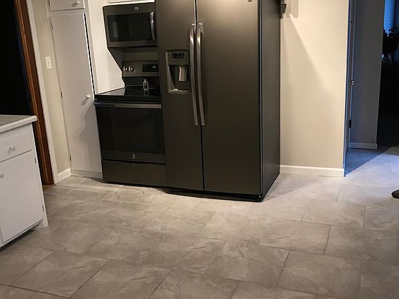 New Slate Appliances in large kitchen with new ceramic tile