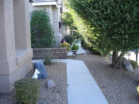 The entrance to the property is to the left and is on the side of the home.