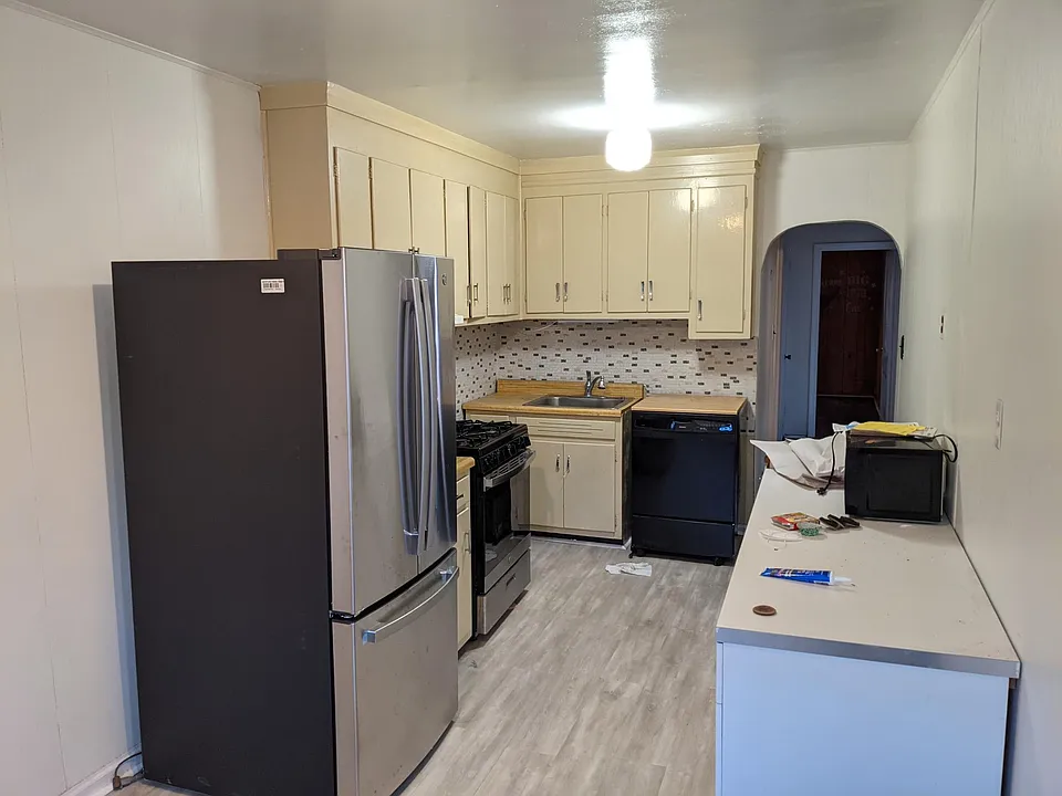 kitchen, new floors, new refregerator and stove