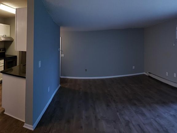 Kitchen, Dining, and Living Room - Brand New Flooring, Appliances, Painting, and Electrical Hardware.