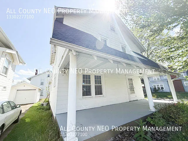 Charming 3 Bedroom Home with Huge Front Porch & Cozy Sunroom! — Photo 1