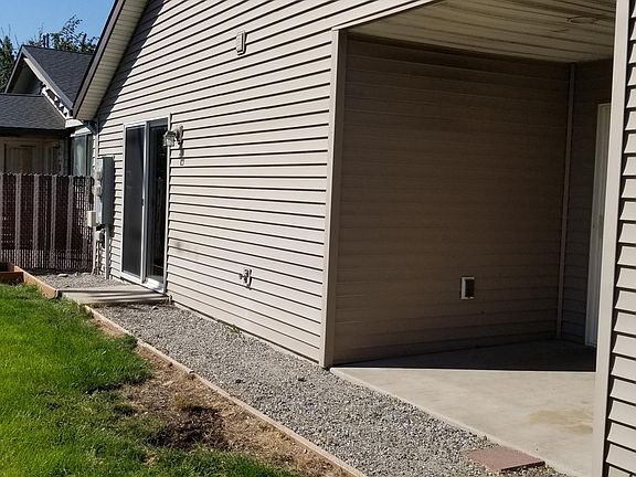 South side with alcove by dinning room slider and master slider.