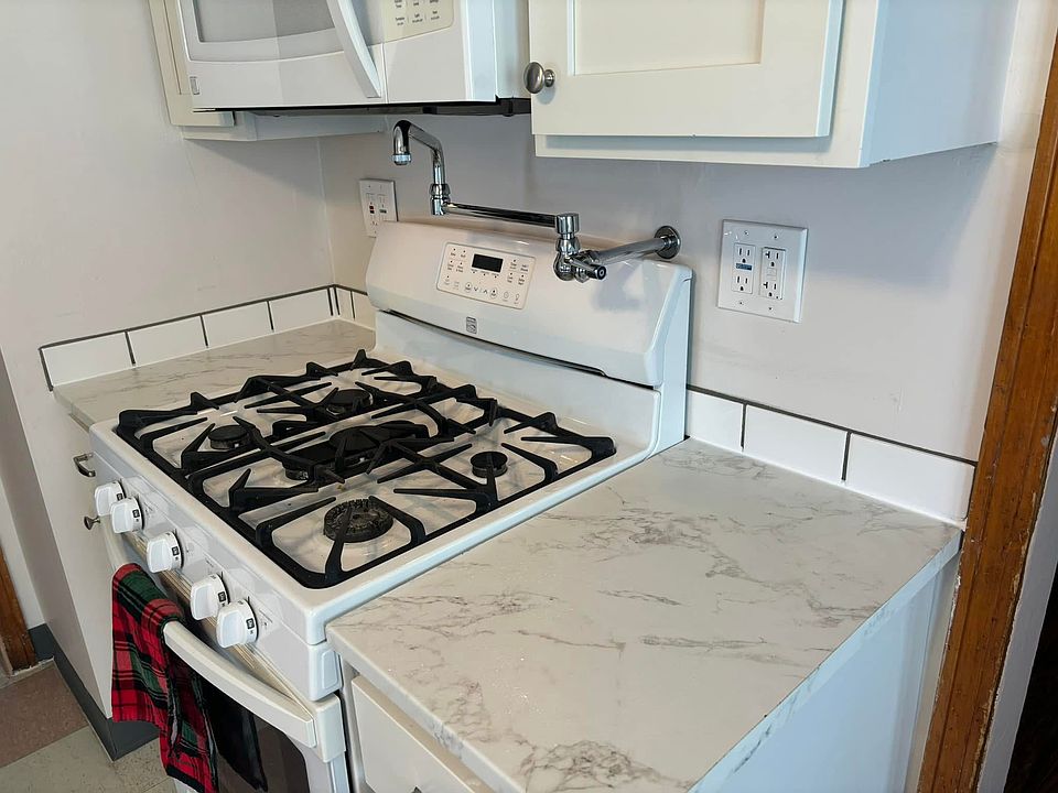 pot filler over stove-top