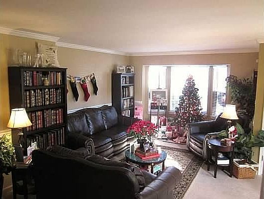 Living room looking out bay window to front yard