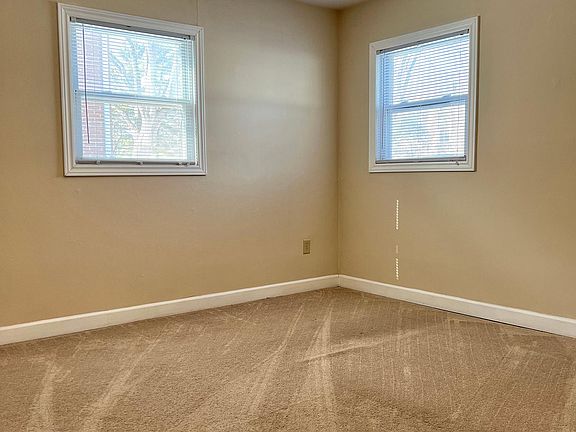 One of two bedrooms, each with large closets