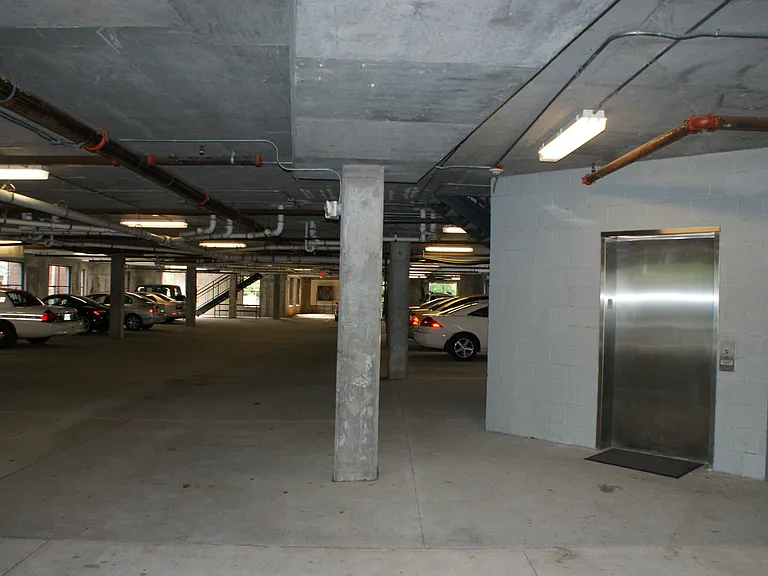 Covered garage with designated parking space