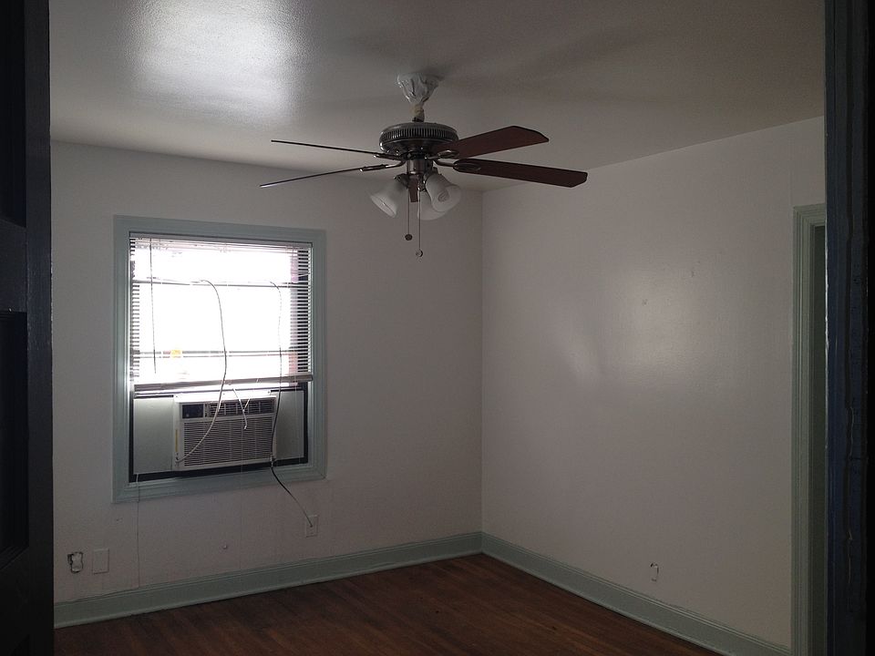 Living room with nickel brushed ceiling fan